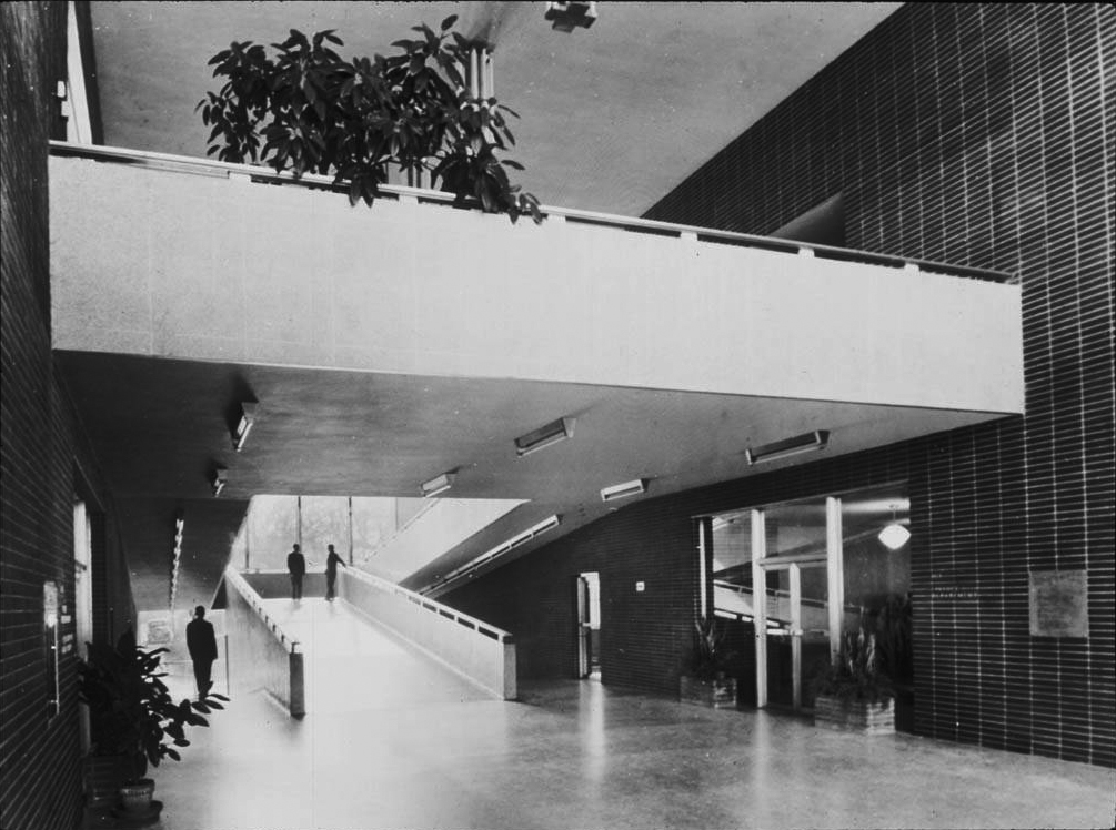 Black and white photograph of the interior of an office building