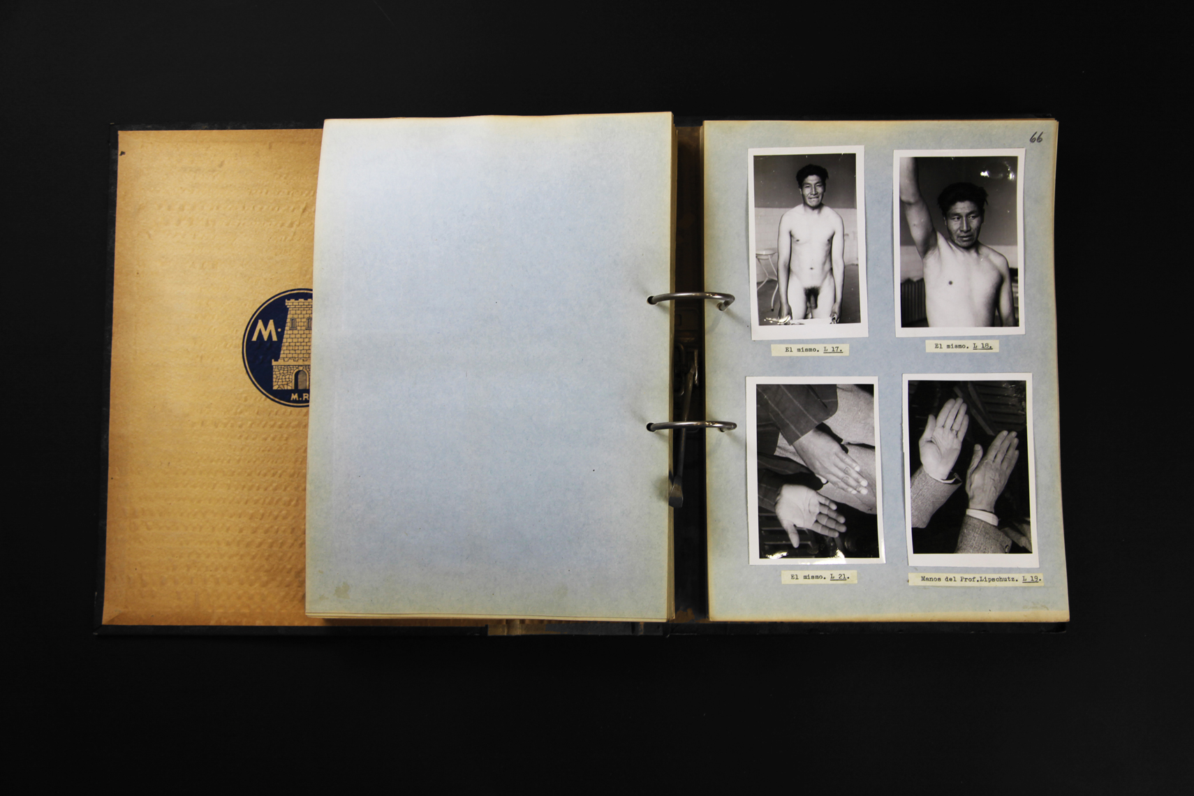 Open binder with right page showing four, black and white photographs, of a person.