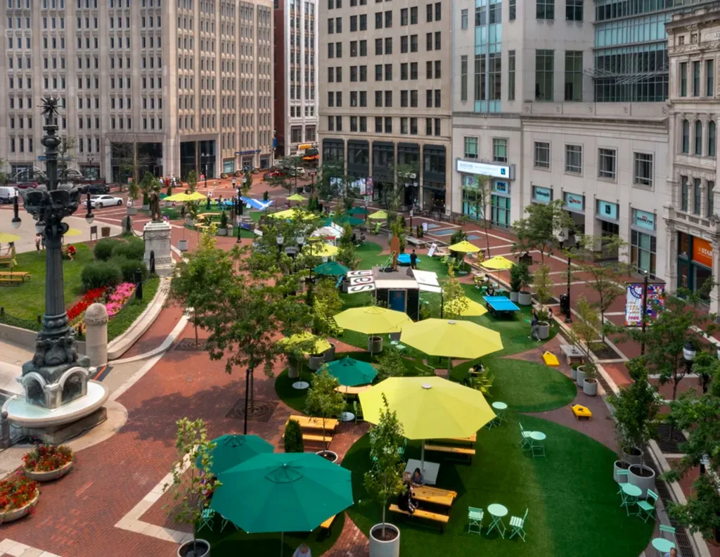 Colorful umbrellas in an outdoor park made from a closed-off traffic circle.