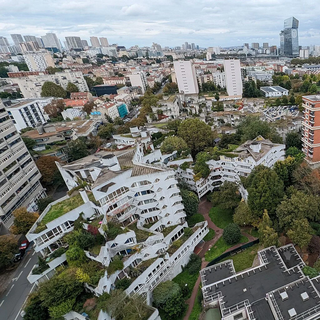 An aerial view of an apartment complex in a dense part of Paris. 