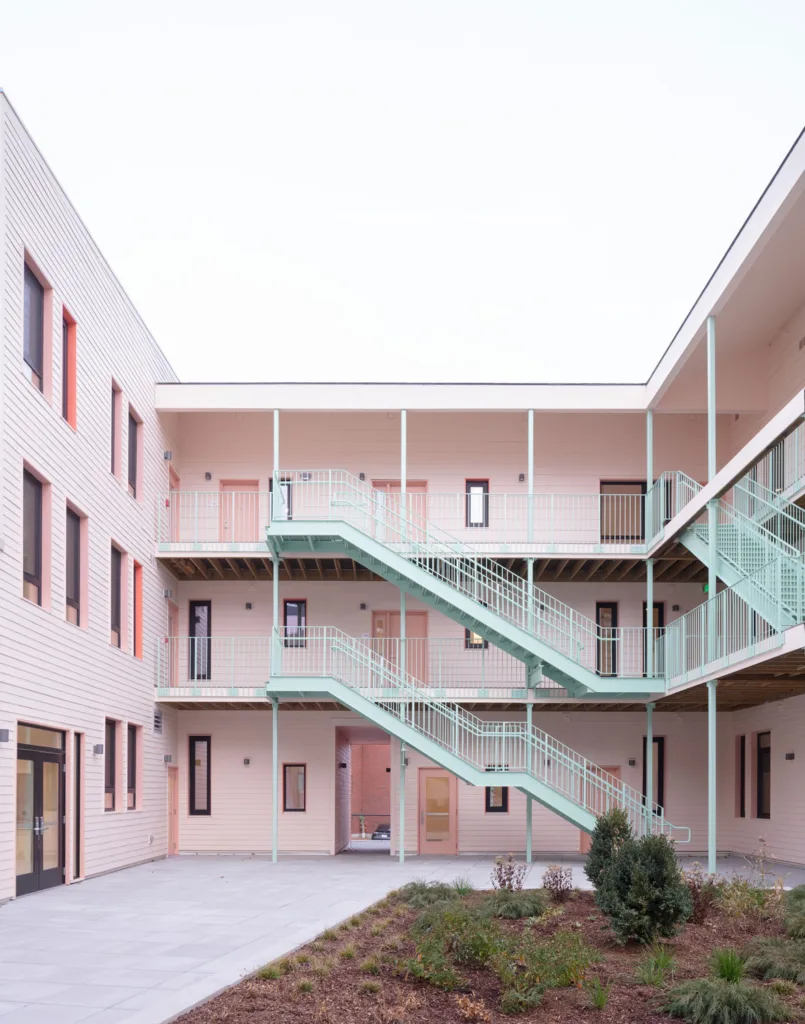 Courtyard of pink building with shagreen stair cases