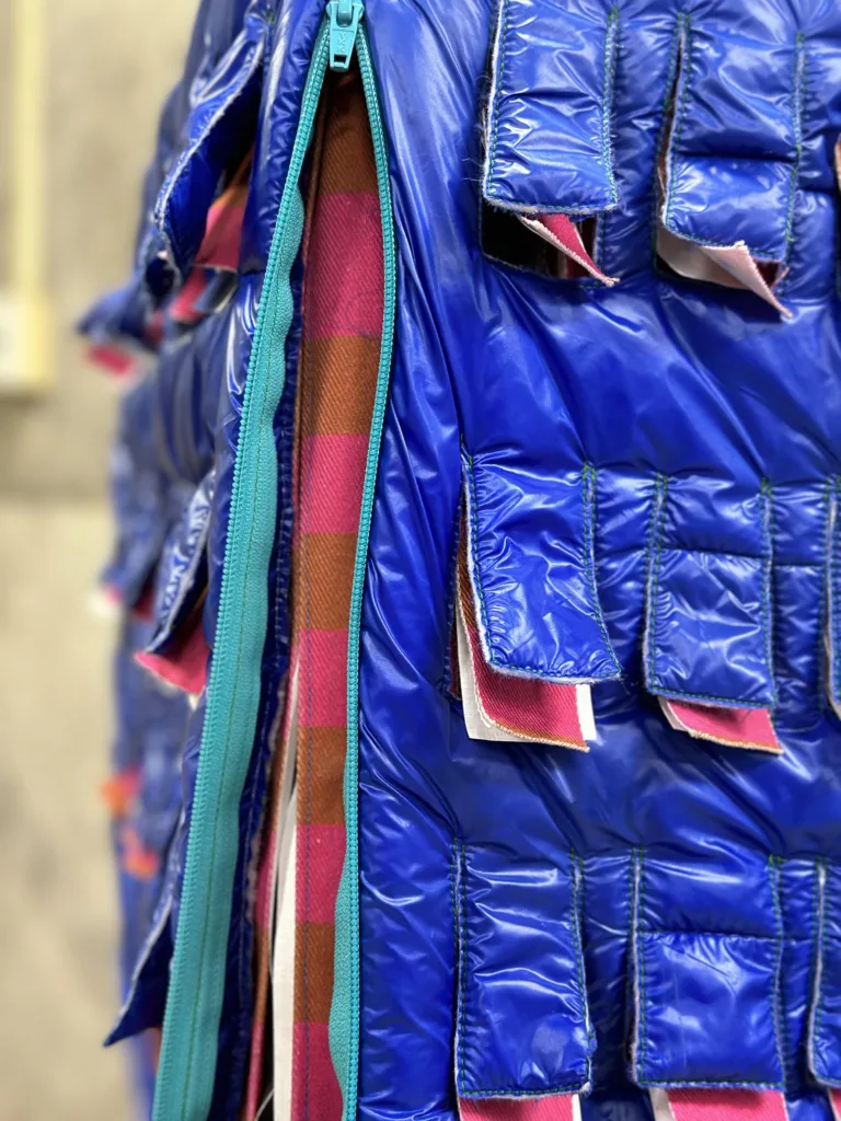 A building model wearing layers of clothing.