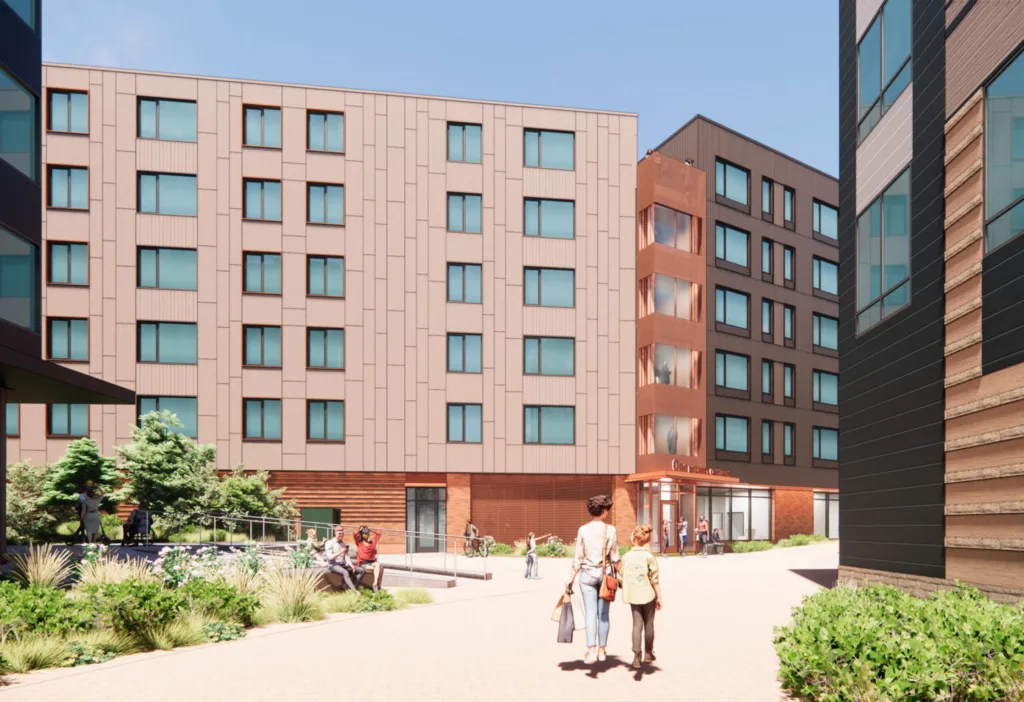 Rendering of mid-rise terracotta colored housing buildings meeting at a central plaza with greenery.