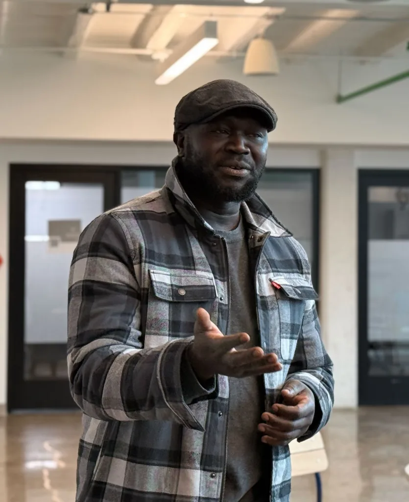 A man standing and talking.