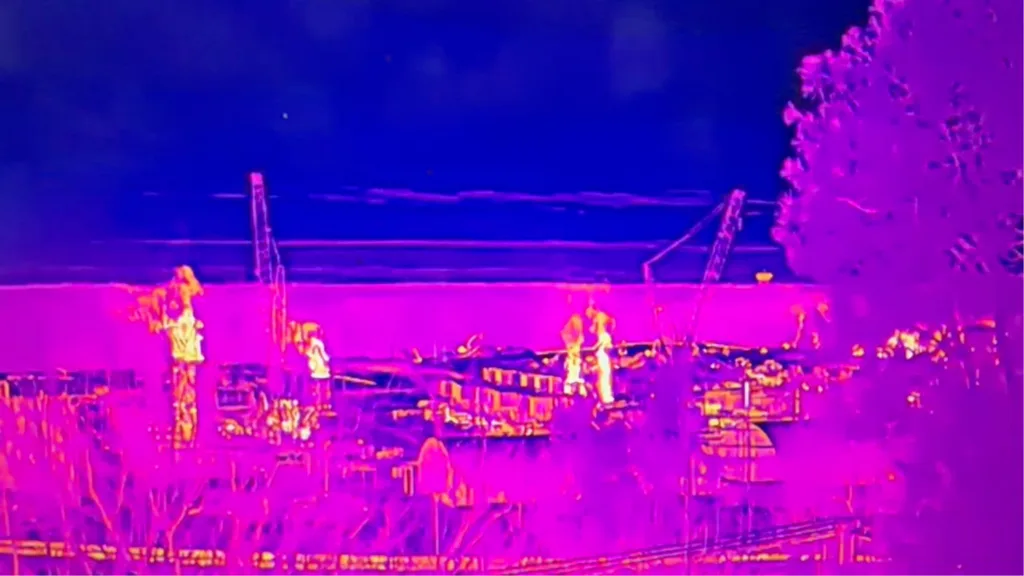 A thermal image in pink and purple that shows emissions from a data center.
