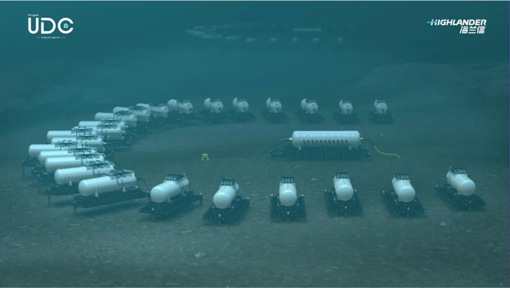 A rendering of an underwater data center featuring a group of several dozen white tanks arranged on the ocean floor.