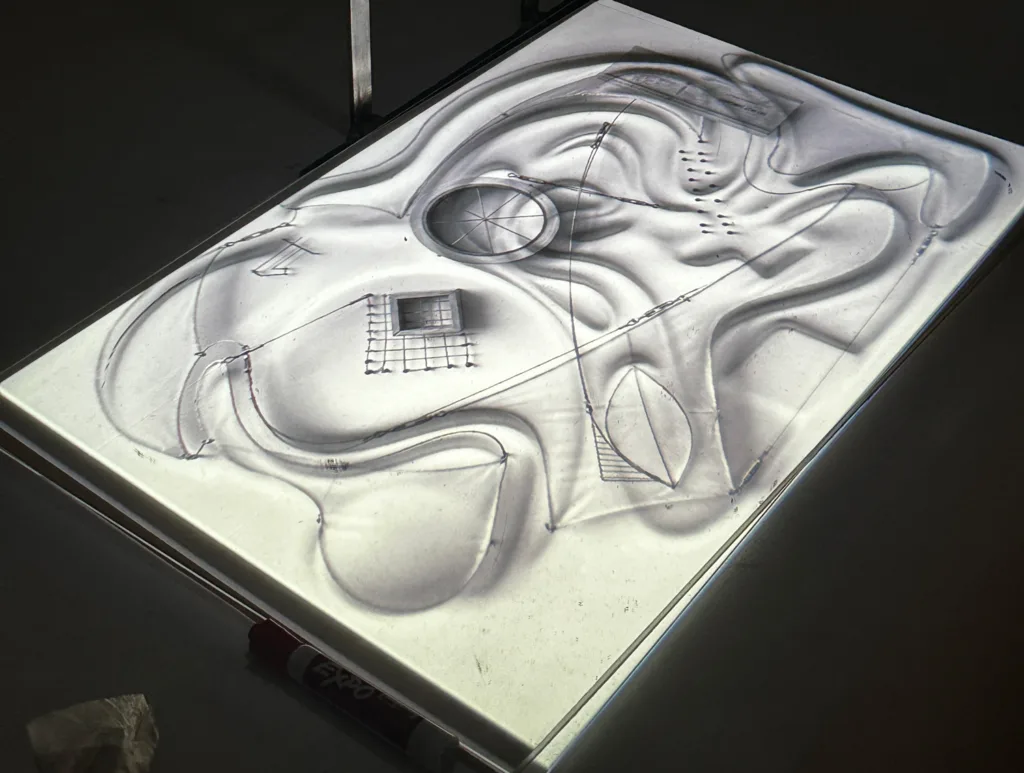 Black background with a white drawing board with shapes.