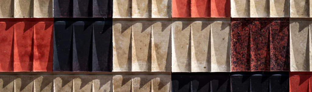 Detail of fluted, weather-resistant shingles made from white and colored wool.