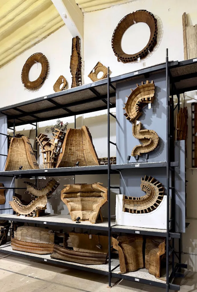 Image inside a shed where wood formworks are stored on shelves.